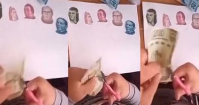 Niña recorta los rostros de varios billetes para su tarea.